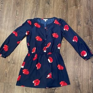 Ruched floral print dress with cinched waist and lined and in navy and red